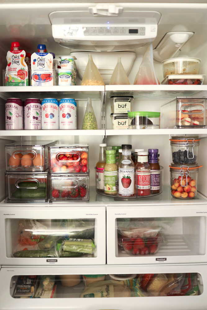 Beautiful, clean and organized fridge with wood and glass storage