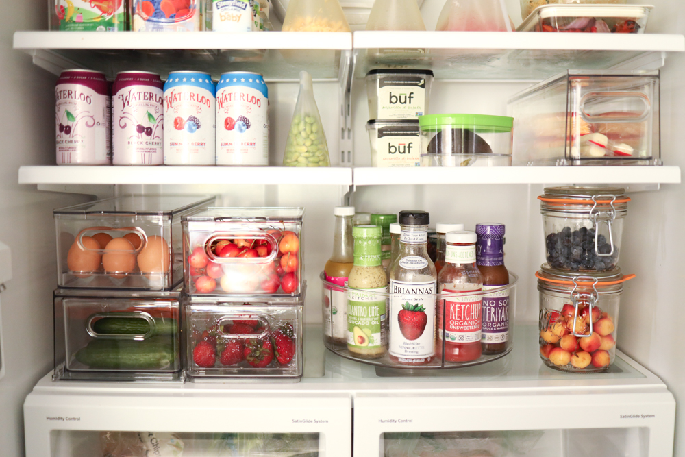 Beautiful, clean and organized fridge with wood and glass storage